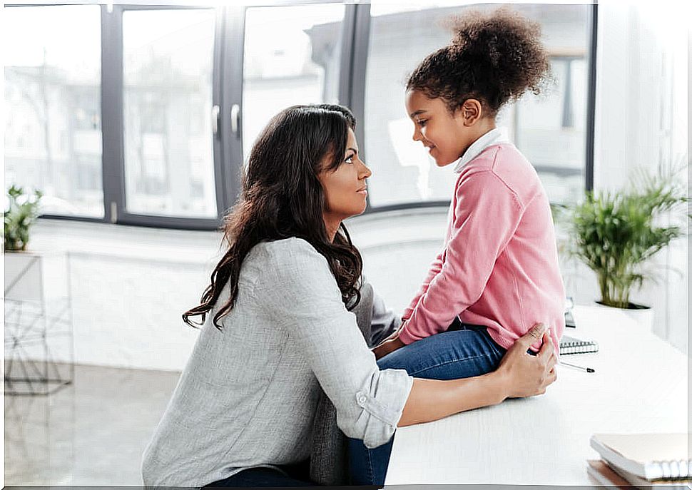 Mother talking to her daughter and telling her some Lev Vygotsky phrases to motivate her.