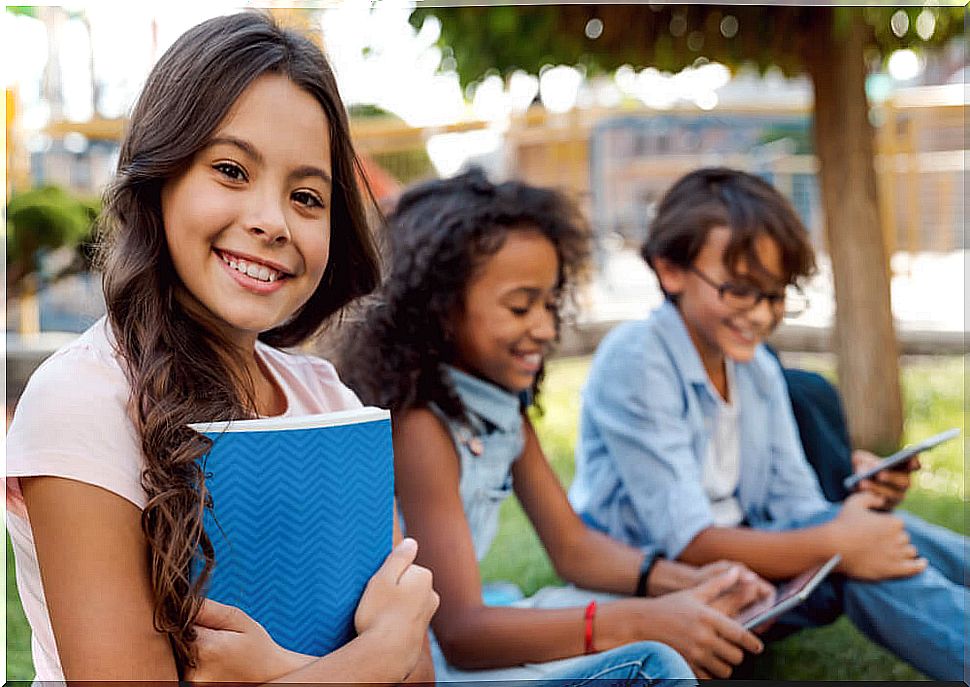 Children outdoors reading some of Lev Vygostky's phrases.