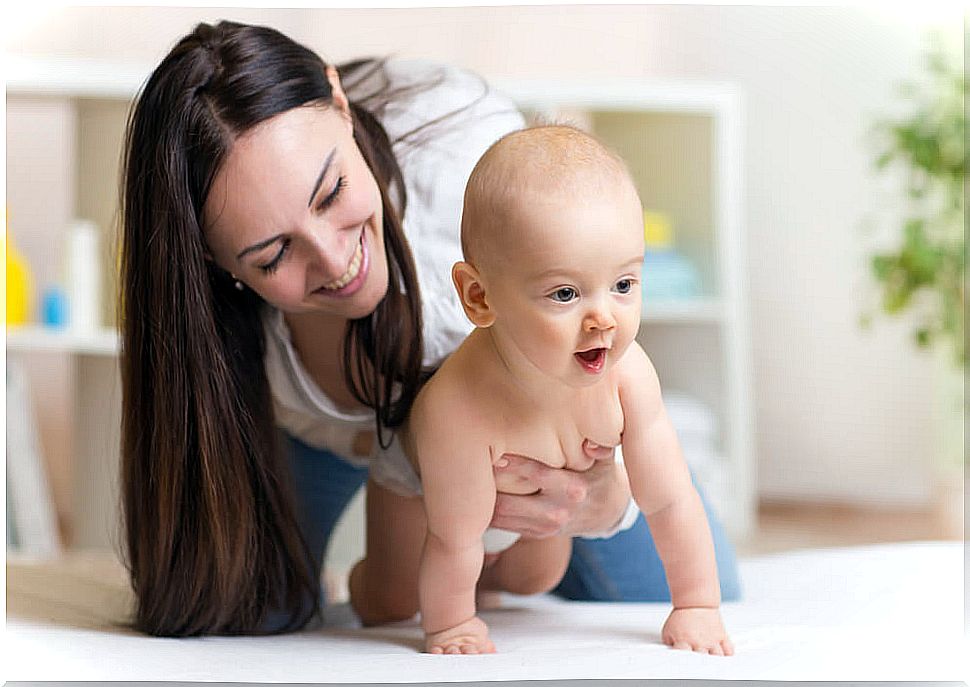 Mom helping her son with the education of a baby.