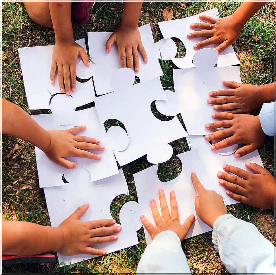 Children playing cooperative games outdoors.