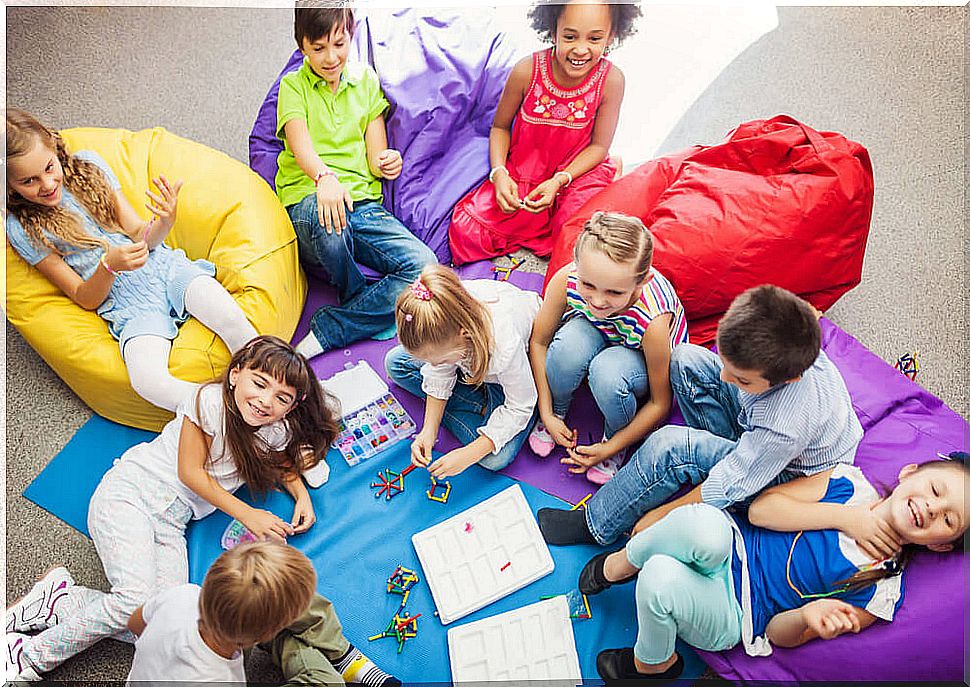 Children playing cooperative games in the classroom