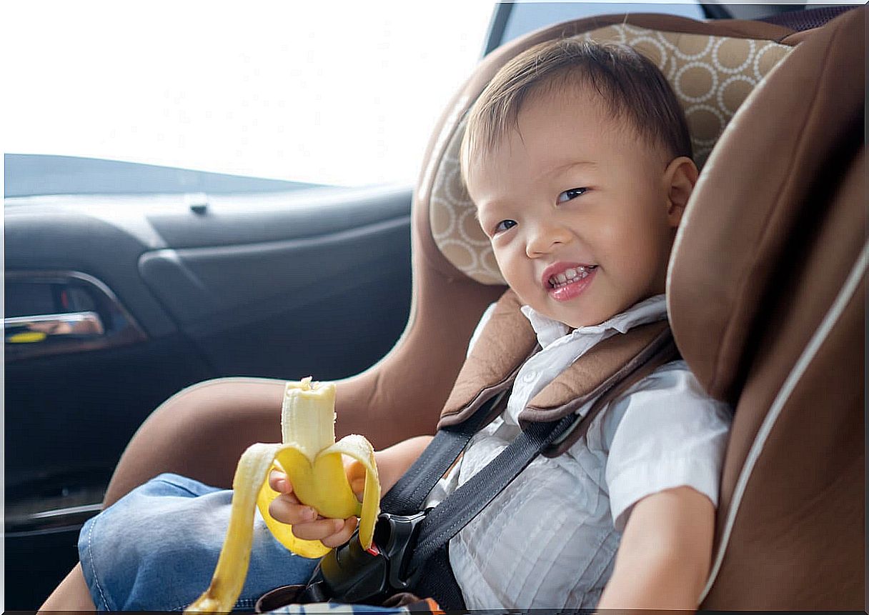 Child eating banana because it has many benefits.