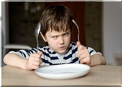 boy-with-spoon-and-fork-angry