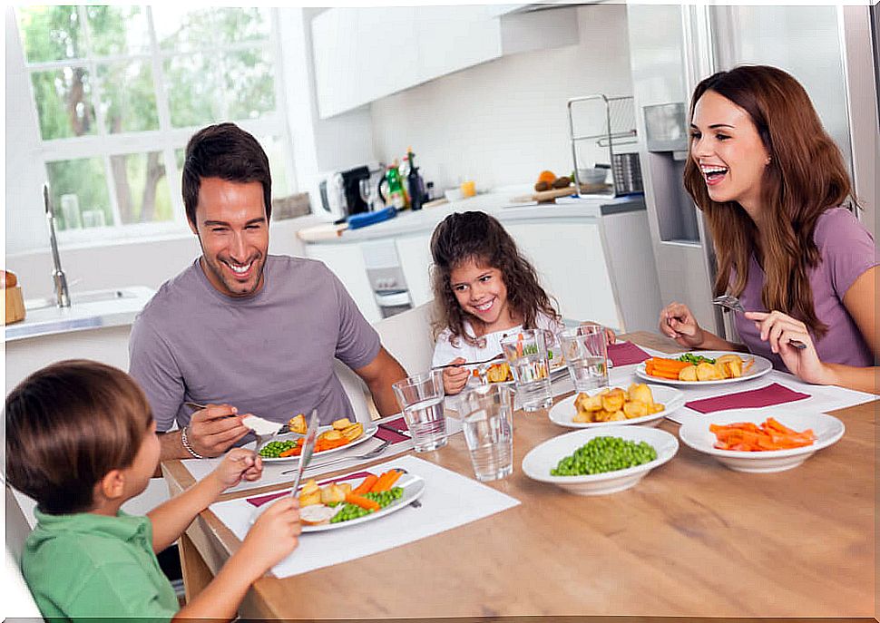 Family eating happily as part of their family life.