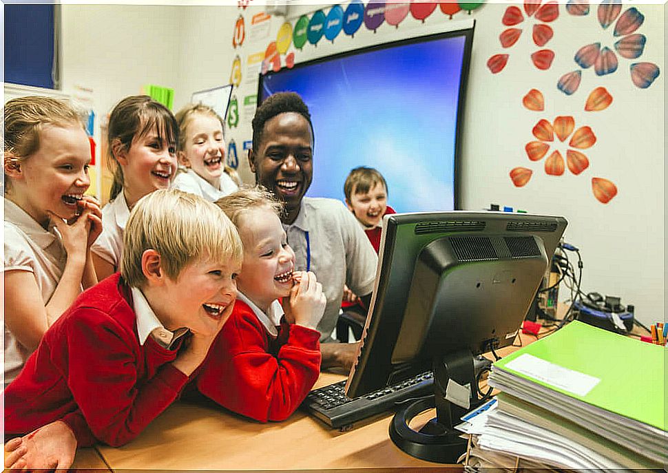 Teacher creating a good atmosphere of coexistence in the classroom with his students.