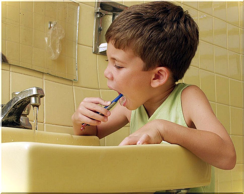 Child brushing his teeth.