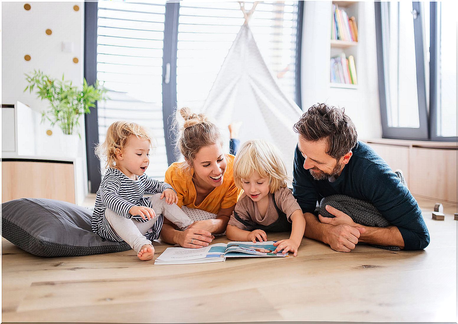 Family reading the Grammar of Fantasy to develop language creativity.