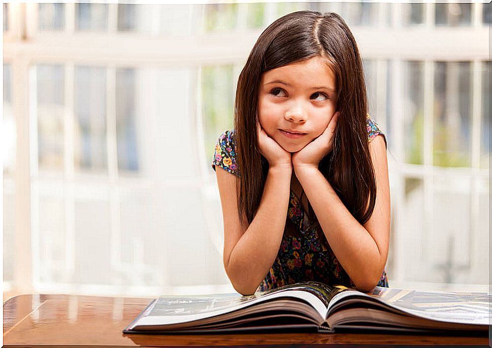 Girl reading and thinking about The Big Book of Superpowers.