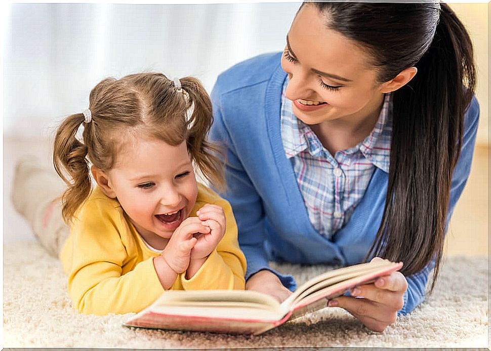 Mother reading a brainstorming story with her daughter.