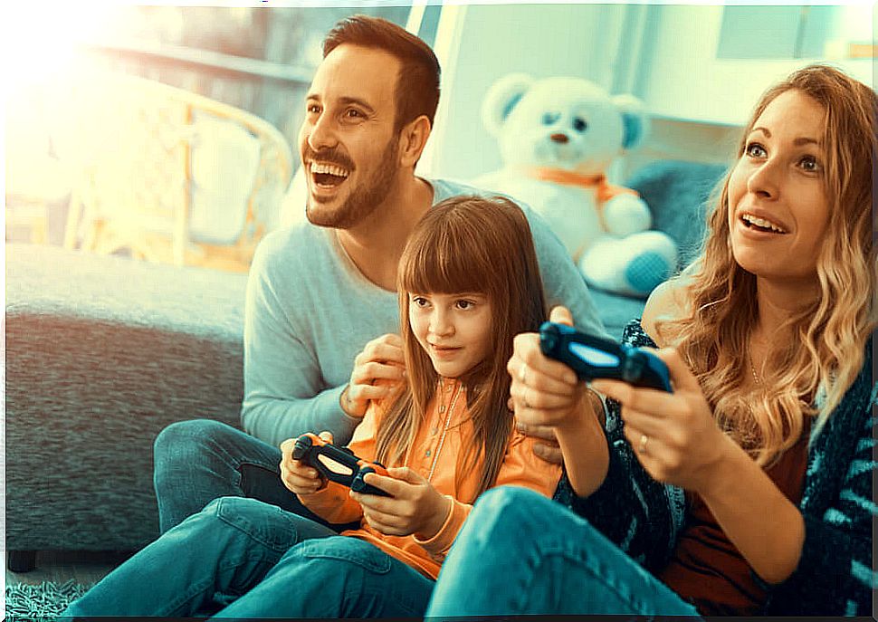 Family playing video games during coronavirus isolation.