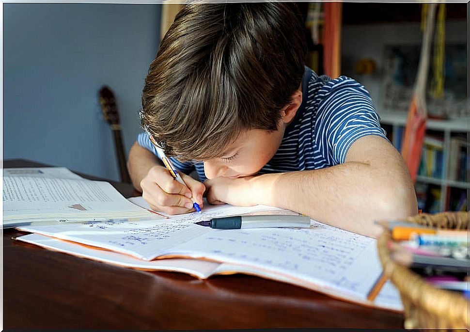 Child doing homework as part of his daily routine.